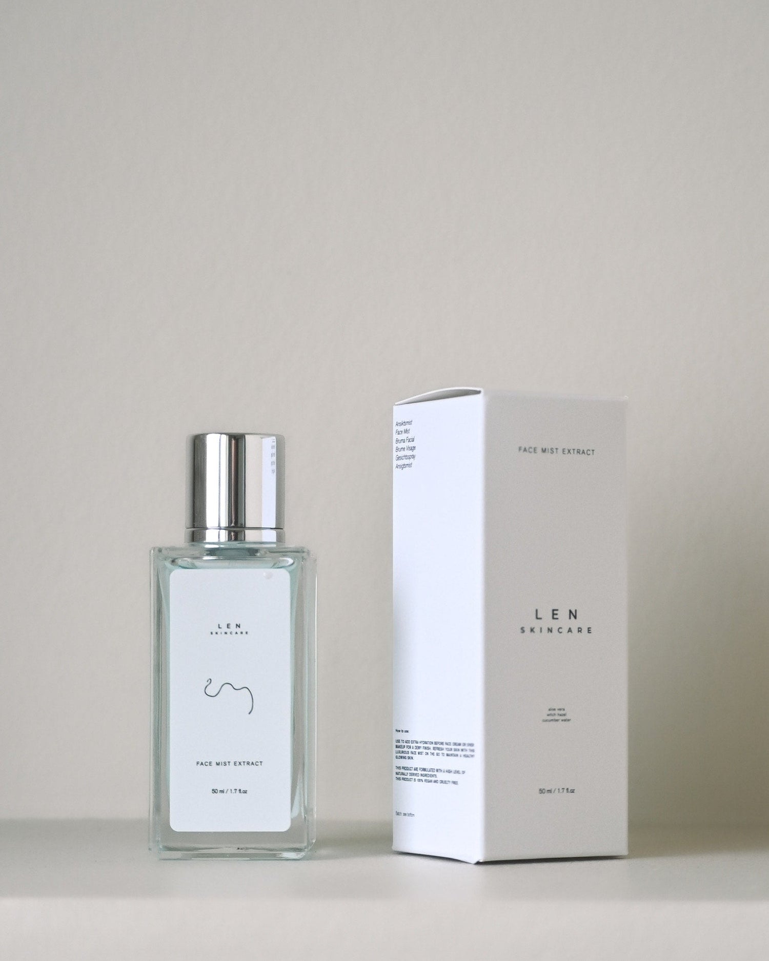 Bottle and packaging of LEN skincare product on a neutral background