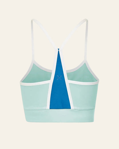 Light blue sports bra with a blue triangle design on a white background