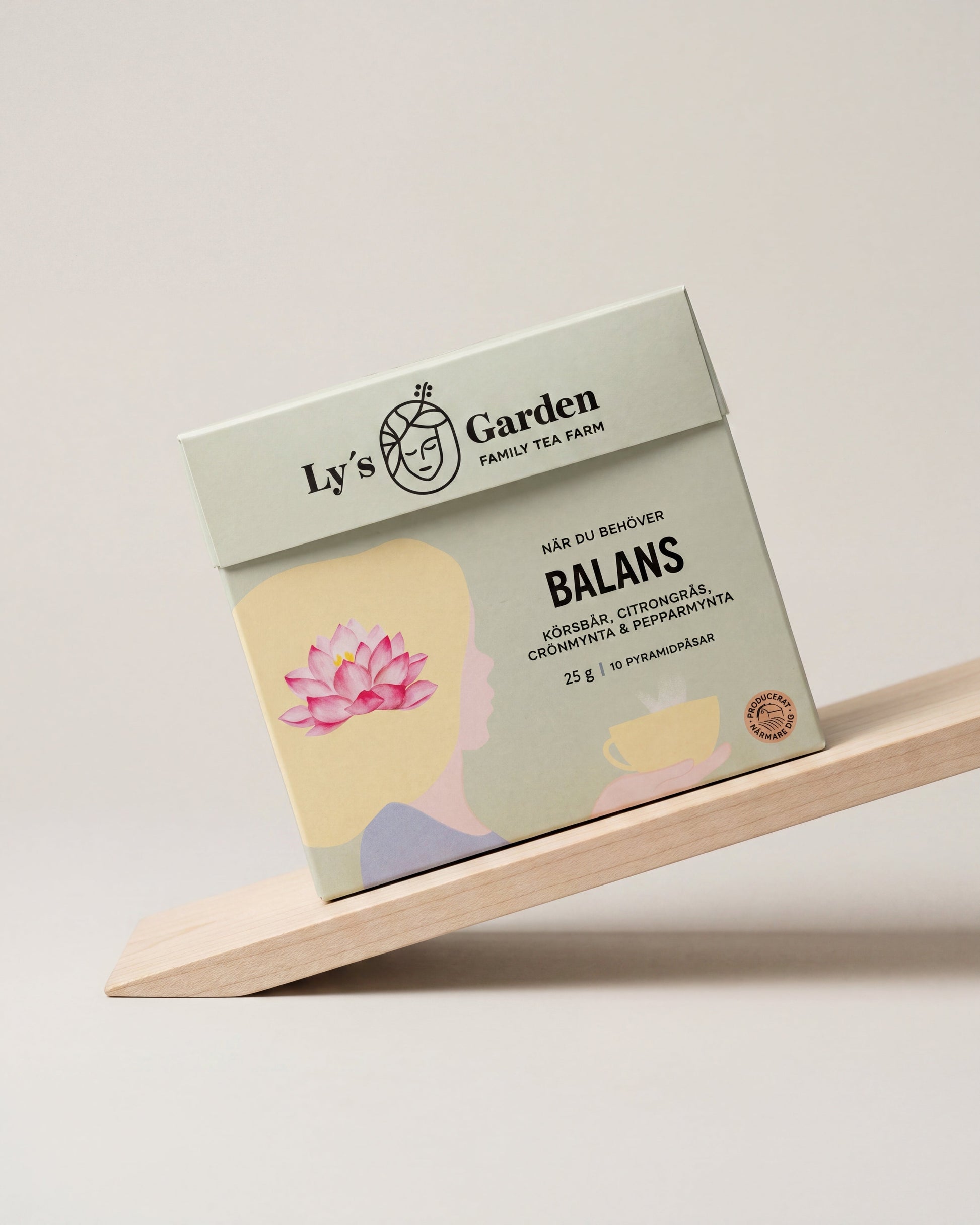 Tea package with 'Ly's Garden' branding on a wooden shelf against a light background