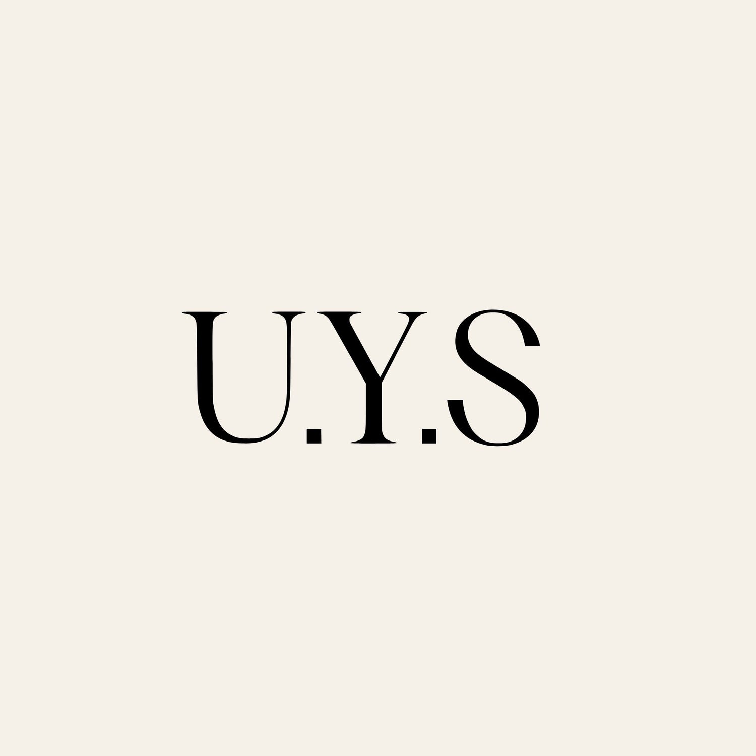 Black text 'U.Y.S.' on a light beige background
